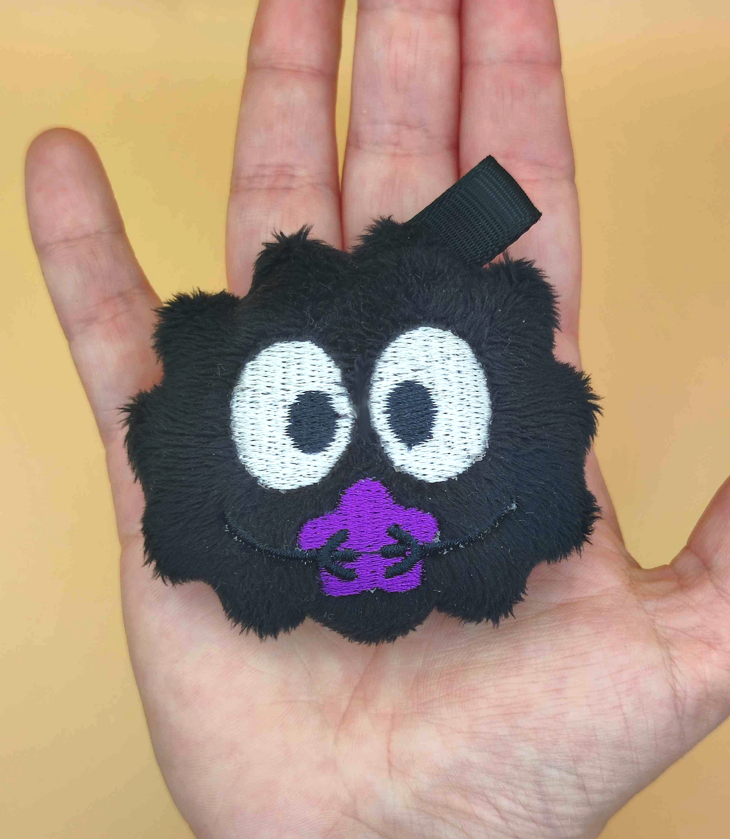 Boule de suie étoilée violet (porte clé)